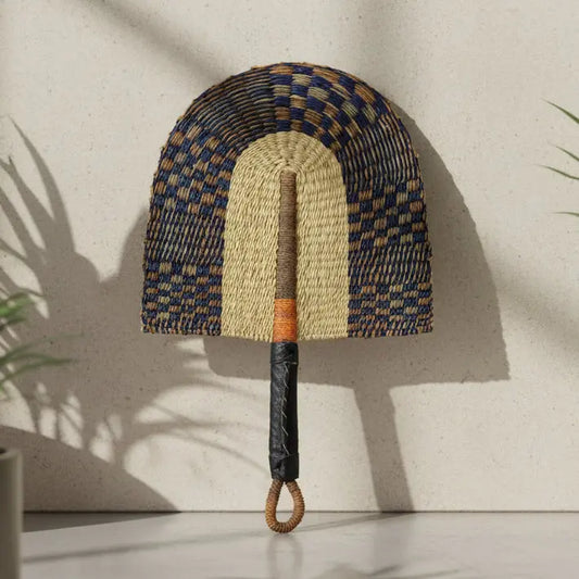 Woven fan with a checkered pattern on a white background